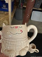 front view of cat mug showing design and handle