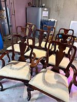 Front view of all eight Queen Anne style chairs arranged in two rows