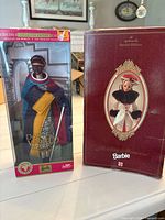 Front view of both boxed Barbie dolls
