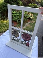 Full view of window pane mirror with shelf