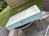 Full view of the rectangular shadowbox on patio table