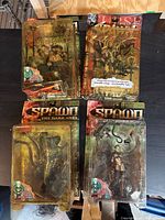 Group shot of four Spawn action figures in original blister packaging