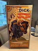 Full view of F. Dick advertising board front showing graphics and text
