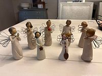 Group image showing all eight Willow Tree angel figurines