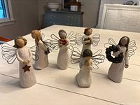 Group shot of all six Willow Tree angel figurines on table