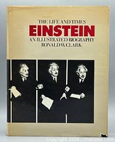 Front cover of book showing title and Einstein photographs