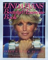 Front cover of Linda Evans Beauty & Exercise Book showing title, author, image