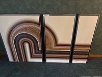 Front view of all three framed panels side by side