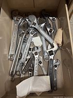 Drawer containing many adjustable wrenches of various sizes