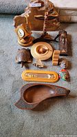 Group view of all 13 decorative wooden and carved items