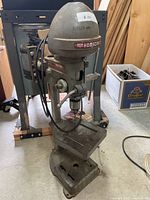 Front view of Delta Homecraft drill press showing head, table and base