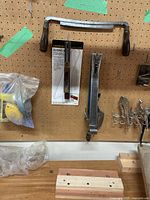 overall view with drawknife, bevel gauge, nail puller, sanding sponges