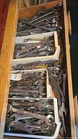 Drawer view showing multiple trays packed with assorted wrenches