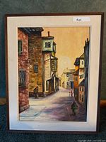 Full view of framed painting showing artwork, signature, frame, and mat