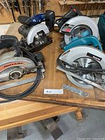 All four circular saws on workbench