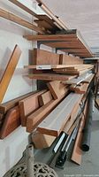 Side view of stacked lumber on wall racks