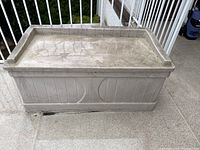 Top view of Suncast resin deck box showing lid surface