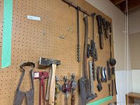 Wide view of pegboard showing majority of vintage tools