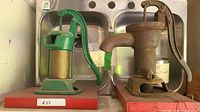 Both water pumps on display to show overall appearance and size comparison