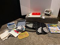 Group shot of all bakeware, linens, cutting board, silicone mold, tin, plaque