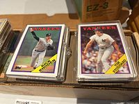 Close-up of two Yankees Topps cards in plastic holders