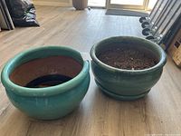 Both ceramic planters side by side showing size and color