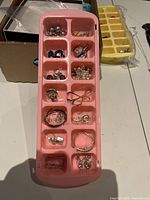overview of tray with assorted jewelry pieces