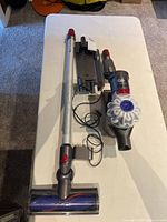 Dyson V7 vacuum components laid out on table