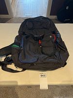 Front of black Lululemon backpack showing external pockets and straps