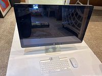 Front view of Apple iMac with keyboard and mouse