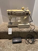 Full view of Singer Stylist 834 sewing machine with foot pedal
