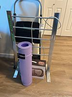 Group shot showing ladder, towel warmer, yoga mat, boxed massager