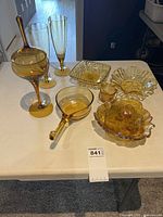 All seven amber glass items on table