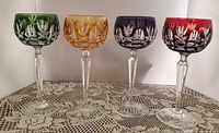 All four colored cut-to-clear crystal wine glasses