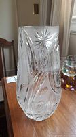 Front view of clear lead crystal vase showing starburst and swirl cuts
