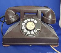 Front view of Northern Electric brown Bakelite rotary telephone