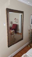Full view of mirror hung on wall