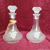 Pair of cut crystal decanters with PORT and SHERRY labels displayed front view