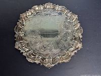 Top view showing full salver design, scalloped rim and engraved surface