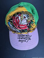 Top view of cap showing front embroidery, chain, brim and mesh back