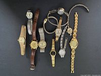 Group shot of twelve assorted women’s wristwatches showing overall variety