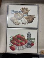 Both framed needlepoint pictures together for overall view