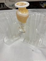 Pair of marble horse bookends and alabaster vase grouped together