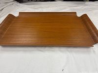 Top view of teak serving tray showing shape and grain