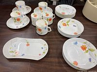 Group shot of all Mikasa Just Flowers pieces on table