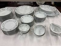 Entire set laid out showing all stacks and serving pieces