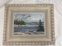 Framed winter landscape oil painting signed S.T.
