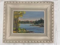 Front view of framed oil painting showing artwork details and signature