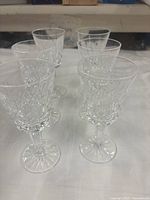 Six Waterford Lismore crystal wine glasses upright on table