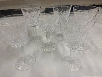 Group of six Waterford Lismore wine glasses showing pattern and stems